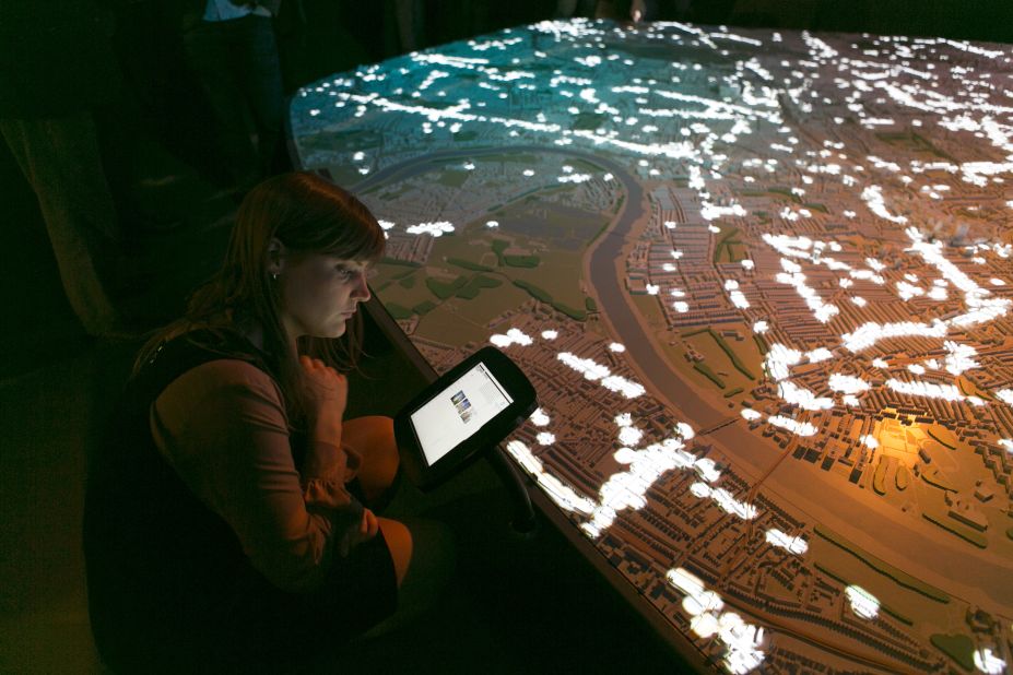 The model illustrates London's architectural development through detailed artistry, projections and interactive films. 