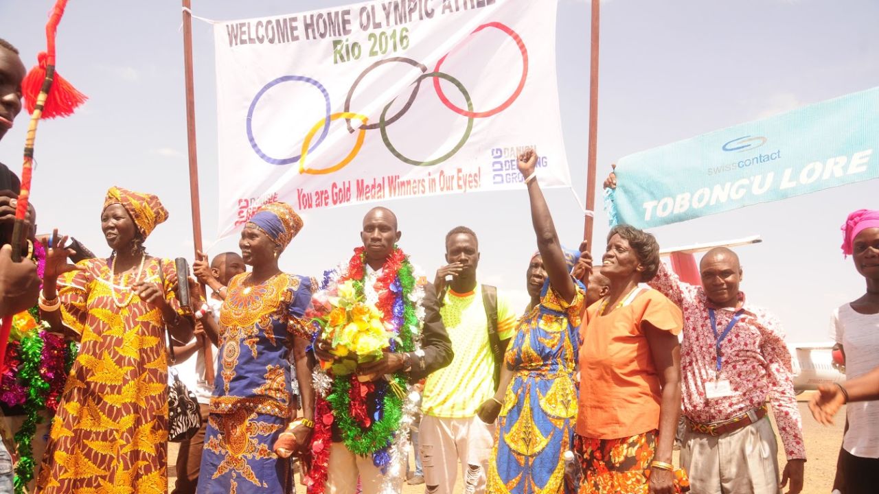Five of the Olympic Refugee Team receive a rapturous reception at Kakuma camp in Kenya where they grew up.