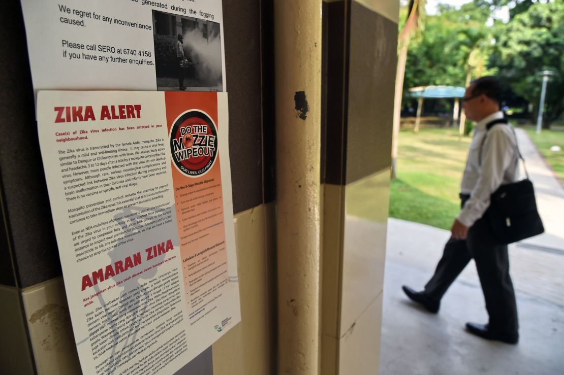 A Zika alert notice is seen posted at the lift landing area of a residential block in the Aljunied Crescent neighbourhood in Singapore on August 29, 2016.   