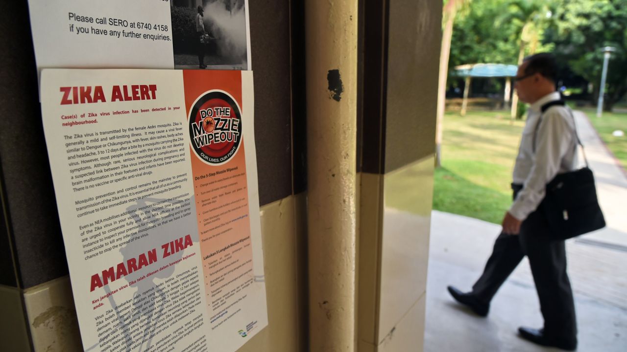 A Zika alert notice is seen posted at the lift landing area of a residential block in the Aljunied Crescent neighbourhood in Singapore on August 29, 2016.   