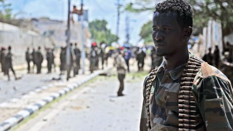 A Somali security force member surveys the blast site Tuesday.