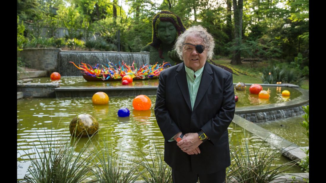 Artist Dale Chihuly's latest show at the Atlanta Botanical Garden features 19 installations throughout the 30-acre garden. "Fiori Boat and Niijima Floats" is behind him at the base of the Earth Goddess in the Cascades Garden. 