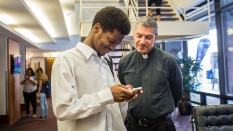 Father Stephen Katsouros, right, is dean and executive director of Arrupe College of Loyola University Chicago.