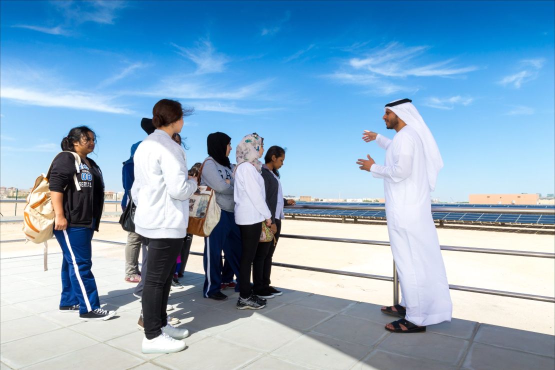 Students visit Masdar City's 10MW solar plant. 