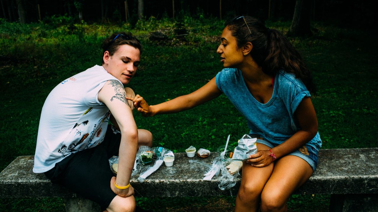Kyle shows Anaële the tattoo he designed in memory of his father, who died on 9/11.