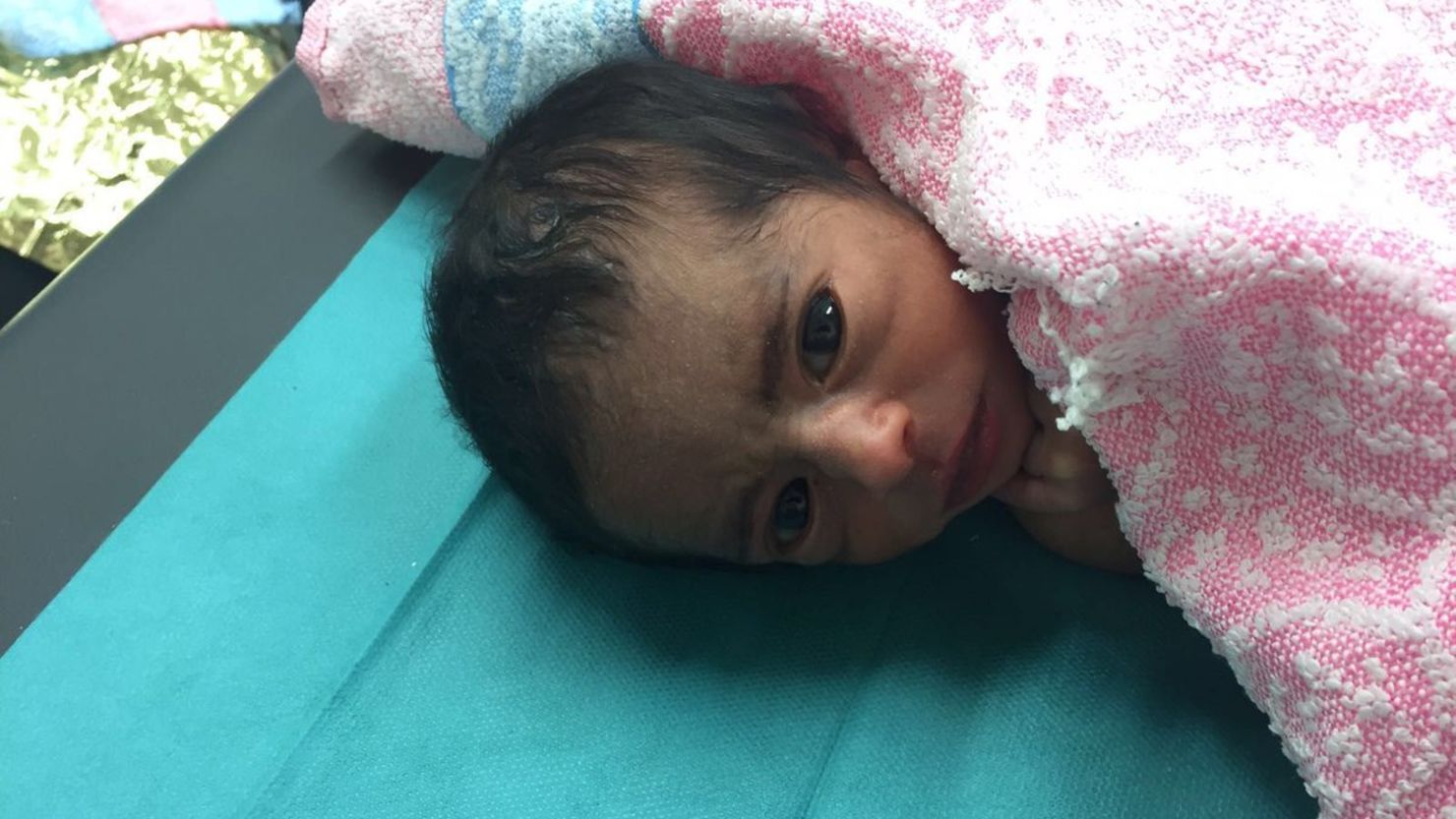 This newborn was among the nearly 7,000 people rescued on the Mediterranean Sea on Monday.