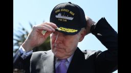 Former Navy Secretary Ray Mabus puts on a hat for the new USNS Harvey Milk during a  ceremony on August 16, 2016.