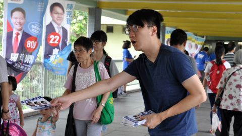 Edward Leung hands out leaflets for Youngspiration candidate Baggio Leung in the New Territories East constituency.