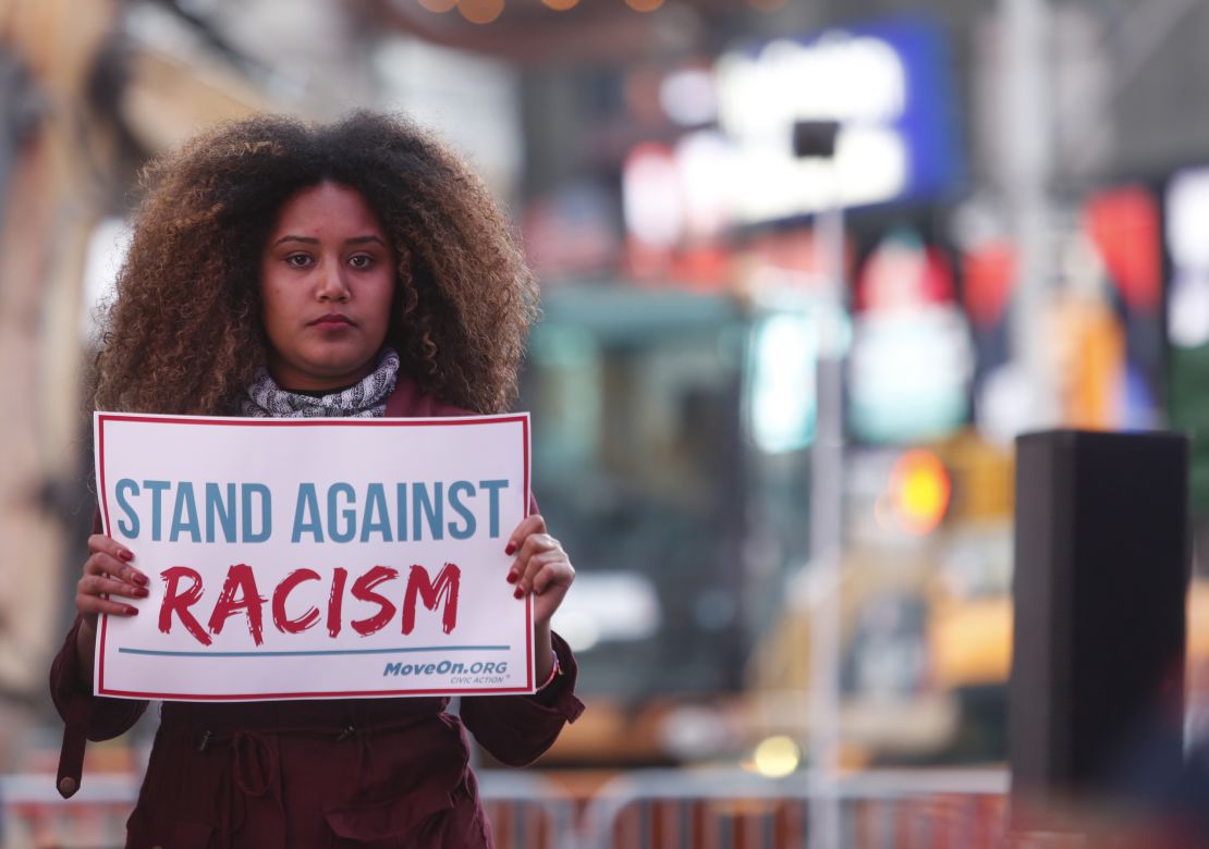 Members of MoveOn.org Political Action protest racism, which they say has become a hallmark of Donald Trump's presidential campaign, in New York City on March 16, 2016.