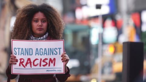 Members of MoveOn.org Political Action protest racism, which they say has become a hallmark of Donald Trump's presidential campaign, in New York City on March 16, 2016.