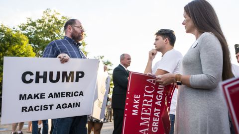 A supporter confronts a protester outside of a rally for Donald Trump at in Akron, Ohio on August 22, 2016.