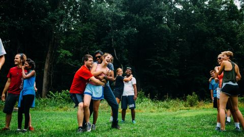 Campers and counselors play the Person-to-Person trust-building exercise at Outward Bound.