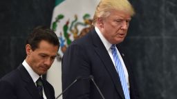 Donald Trump (R) and Mexican President Enrique Pena Nieto prepare to deliver a joint press conference in Mexico City on August 31, 2016. 