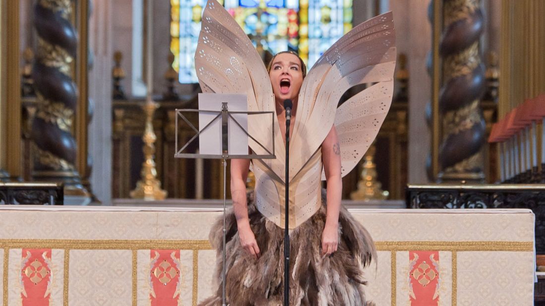 Björk performs at the Alexander McQueen memorial service at St Pauls Cathedral in London wearing garments by the late designer. 