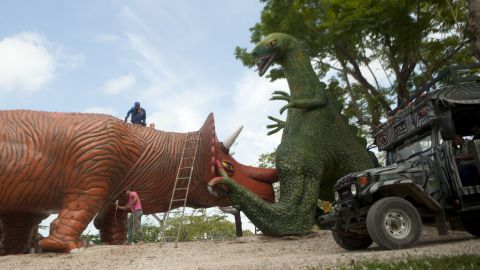 The "Jurassic Park" simulation includes dinosaur statues.