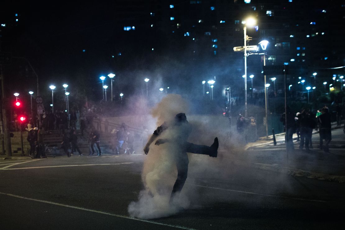 Pro-Rousseff protesters clash with police during Wednesday night's march in Sao Paulo. 