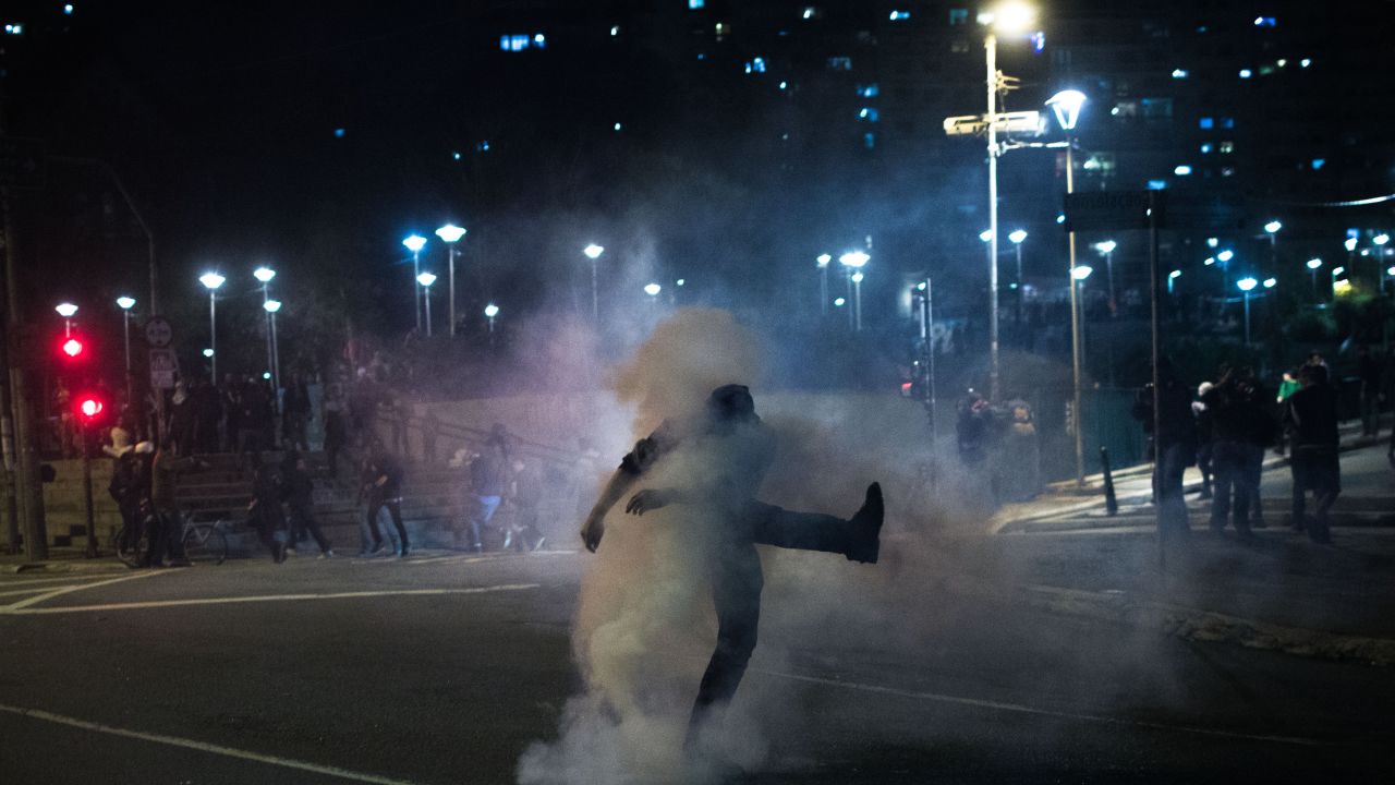 Pro-Rousseff protesters clash with police during Wednesday night's march in Sao Paulo.