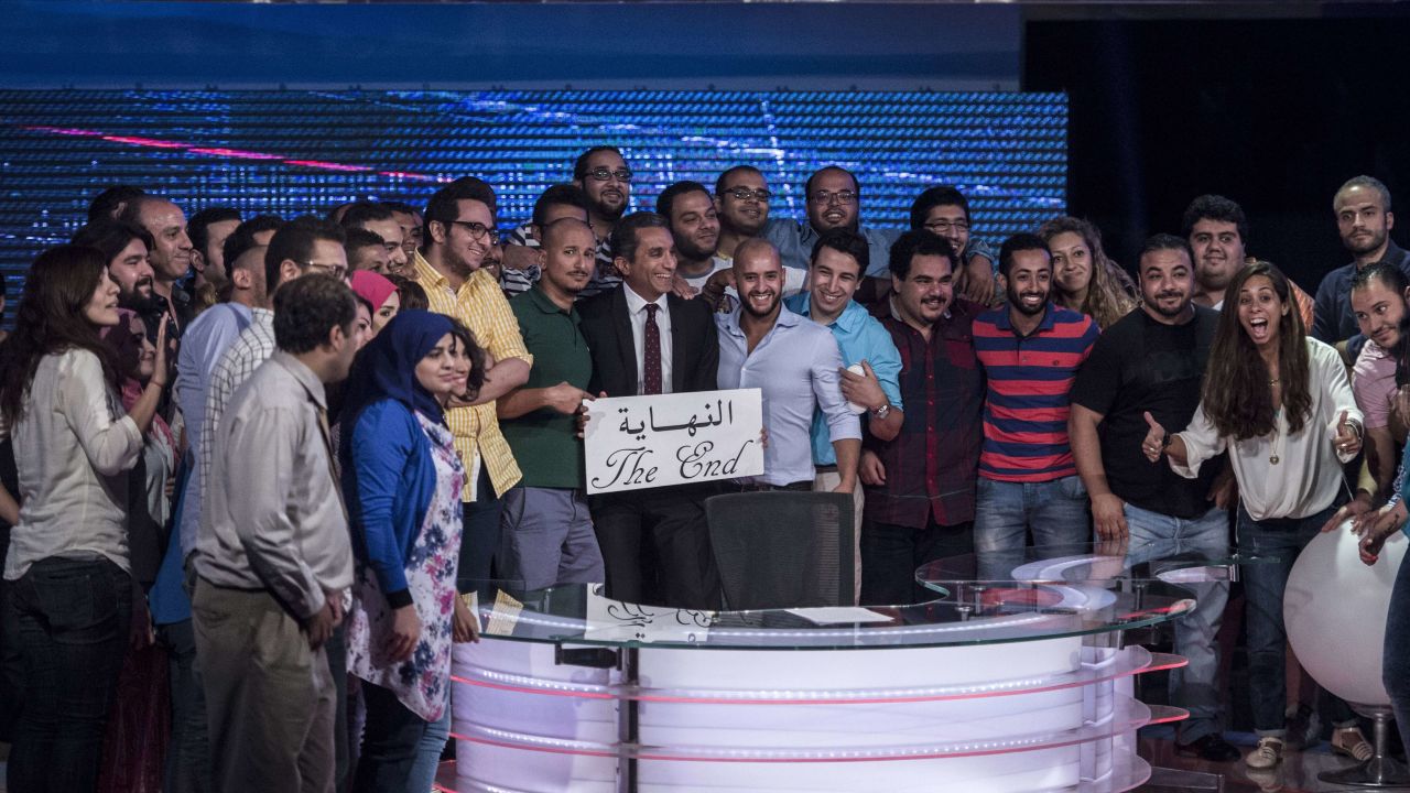 Youssef and his team hold a card that reads "the end" in Arabic to announce the end of "Al-Bernameg" in Cairo, Egypt on June 2, 2014.