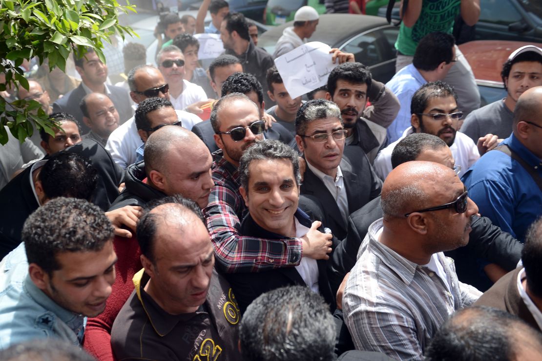 Youssef is surrounded by supporters upon his arrival at the public prosecutor's office in the high court in Cairo, Egypt on March 31, 2013.