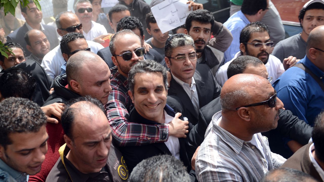 Youssef is surrounded by supporters upon his arrival at the public prosecutor's office in the high court in Cairo, Egypt on March 31, 2013.