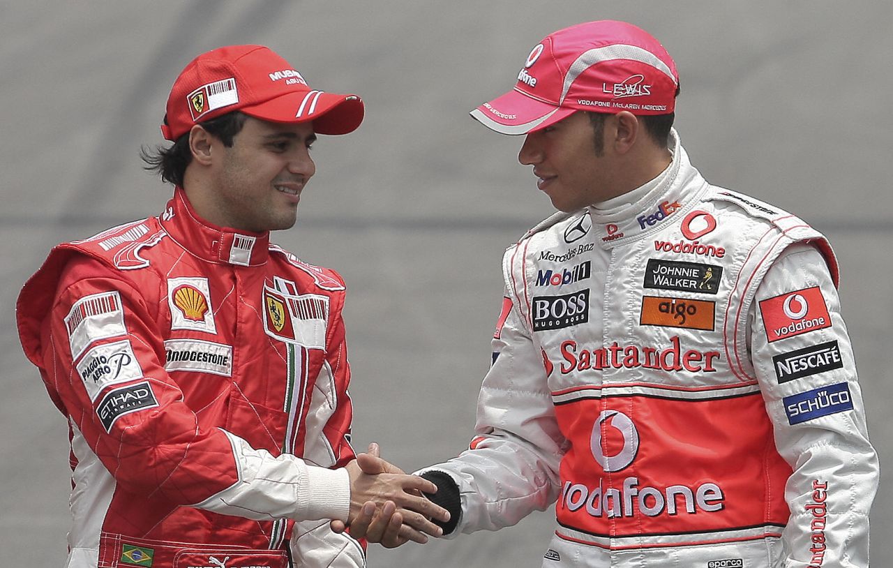 He would go on to enjoy his most successful period on the track with Ferarri, as the Brazilian clocked up 11 race wins and 36 podiums. Just a single point separated Massa from the championship in 2008 as he pushed McLaren's Lewis Hamilton (right) all the way.  