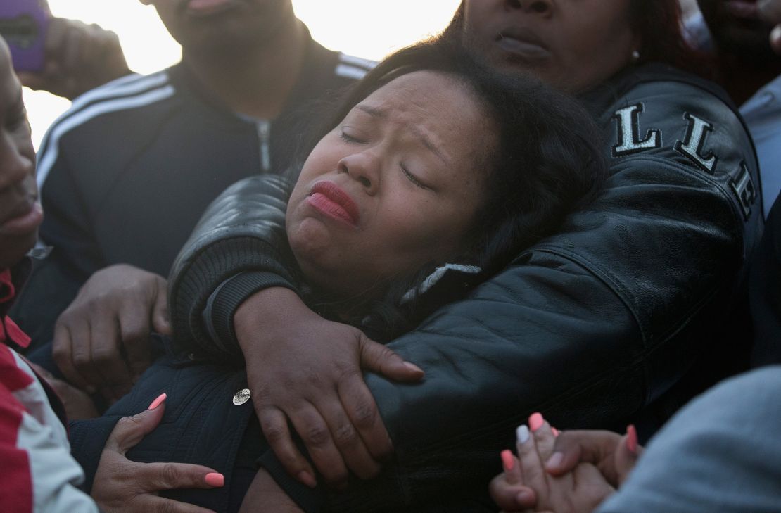 Tambrasha Hudson is comforted as she joins demonstrators protesting the shooting death of her son 16-year-old Pierre Loury on April 12, 2016 in Chicago.