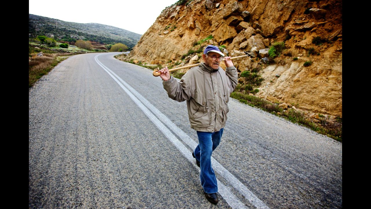 Active lifestyles in combination with healthy, balanced meals eaten early are revered as being the key to living a long and healthy life. Pictured, a 99-year-old man on a daily three-mile uphill walk to tend a herd of goats on Ikaria.