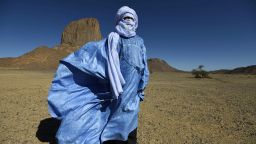 A Tuareg poet in a blue robe poses for a photo in Tagmart plateau, around 30 kilometres (20 miles) outside Tamanrasset in Southern Algeria, on January 12, 2016.




The imzad, a single-stringed violin played only by Tuareg women, is making a comeback in Algeria as the last of its players come to the rescue of a tradition on the verge of extinction.
 

 / AFP / Farouk Batiche / TO GO WITH AFP STORY BY AMER OUALI        (Photo credit should read FAROUK BATICHE/AFP/Getty Images)