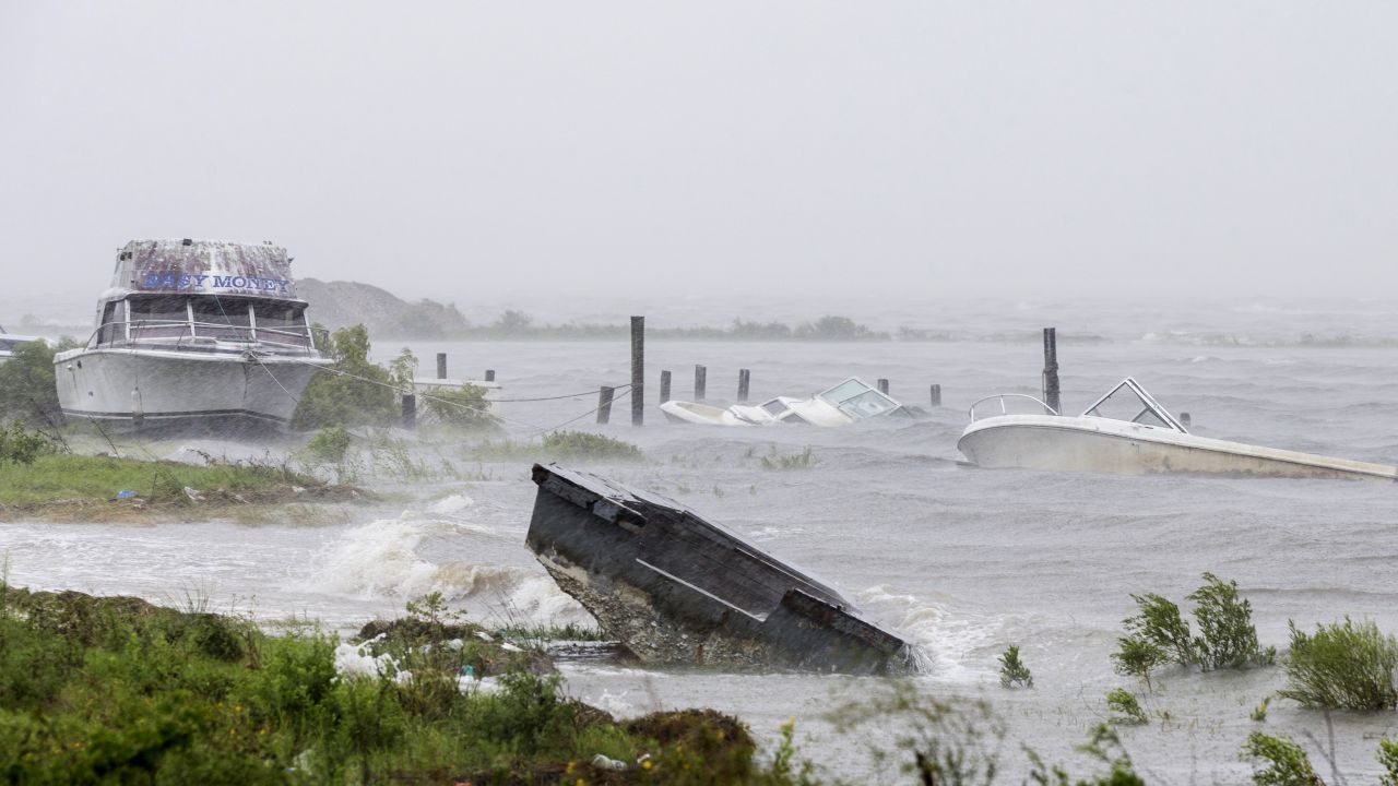 Sunken and beached boats line the shore in Eastpoint on September 1.