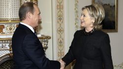 US Secretary of State Hillary Clinton (R) shakes hands with Russian Prime Minister Vladimir Putin (L) outside Moscow in Novo-Ogarevo on March 19, 2010. Russian Prime Minister Vladimir Putin met US Secretary of State Hillary Clinton and used the occasion to bemoan Moscow's stalled WTO application and the state of bilateral trade. Russia, the world's largest economy outside the global trade body, has repeatedly accused Washington of hindering its efforts to join the World Trade Organization in talks that have dragged on since 1993.