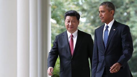 US President Barack Obama and Chinese President Xi Jinping arrive for a joint press conference in the Rose Garden at the White House on September 25, 2015.