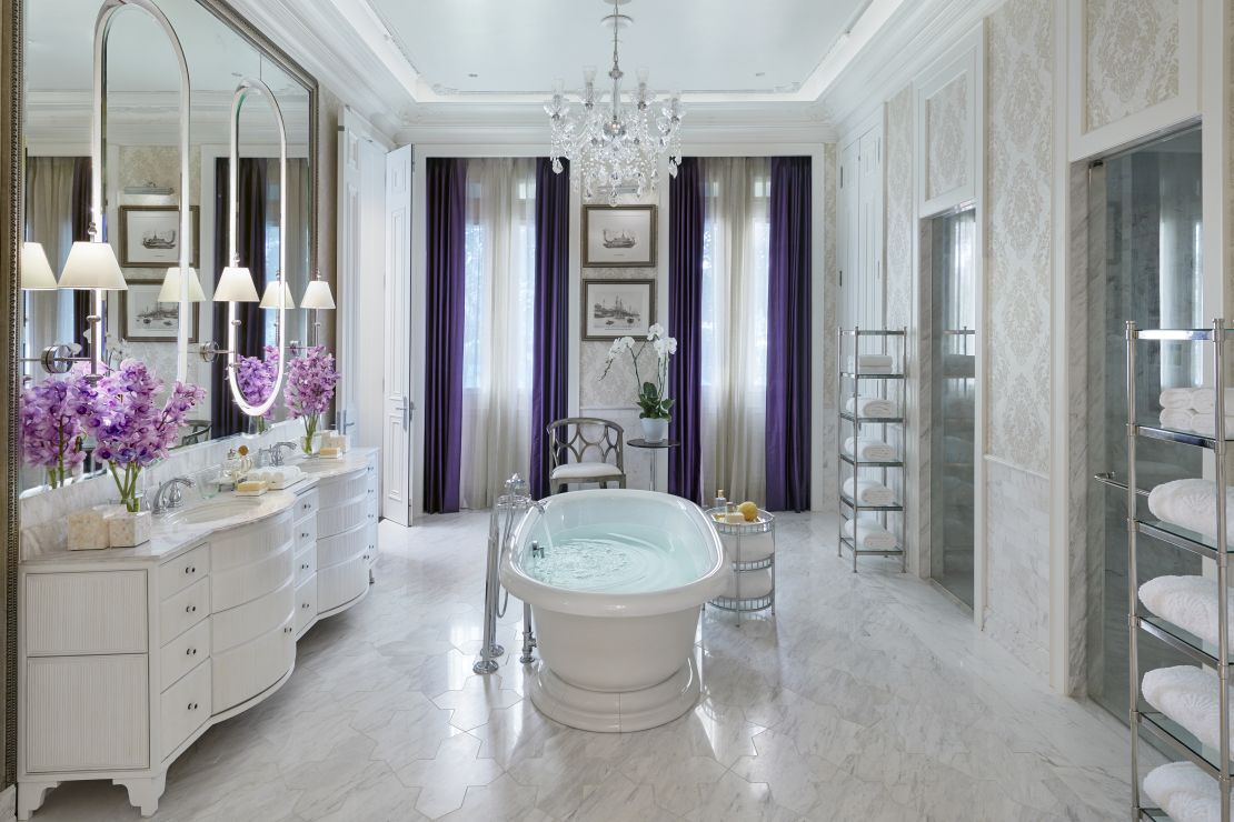 The bathroom of the Mandarin Oriental's presidential suite features splashes of purple Thai silk.