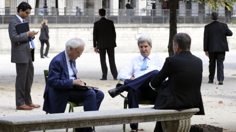 Kerry talks with Charles Rivkin, then US ambassador to France, and Martin Indyk, then special envoy for Israeli-Palestinian negotiations, in 2013 in Tuileries Garden in Paris.