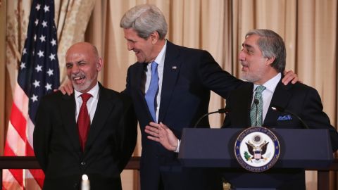 Kerry, Afghanistan President Ashraf Ghani and Afghanistan Chief Executive Abdullah Abdullah share a moment during a 2015 dinner hosted by the State Department in Washington.