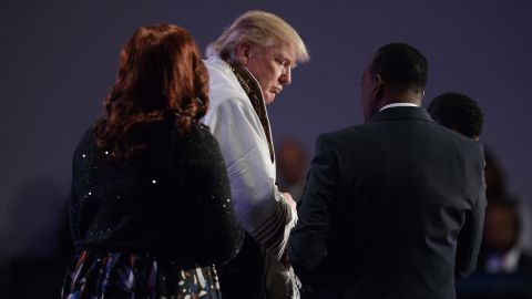 Donald Trump wears a prayer shawl during a church service at Great Faith Ministries, Saturday, September 3, in Detroit.