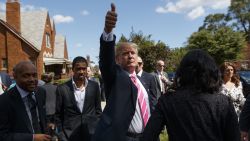 Republican presidential candidate Donald Trump gives a thumbs up during a visit to the childhood home of Dr. Ben Carson on Saturday, September 3 in Detroit.