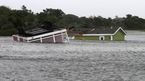 Two structures sit flooded in the creek behind the Hatteras Sands Campground in Hatteras, North Carolina.  