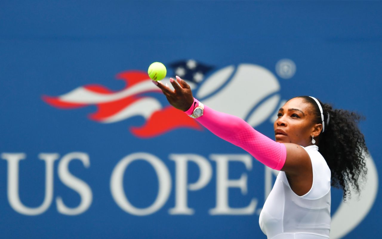 Serena Williams serves to Johanna Larsson during the pair's 2016 US Open round three match.