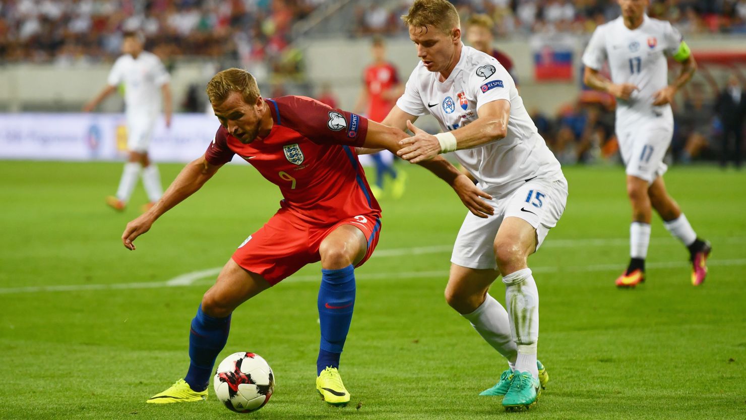 Harry Kane of England holds off Tomas Hubocan of Slovakia during the World Cup Group F qualifying match.
