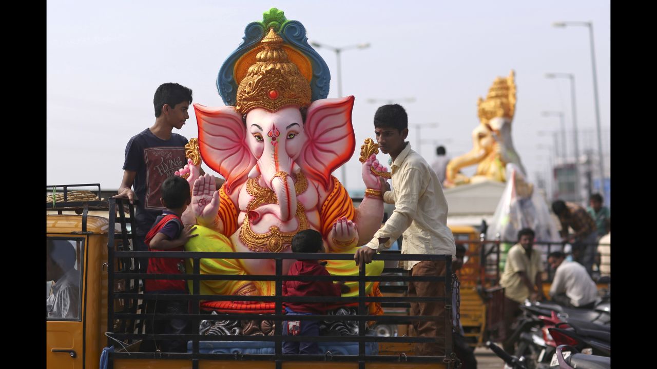 Men carry an elephant-headed idol to worship during the Ganesh Chaturthi festival, in Hyderabad, India on September 5. 