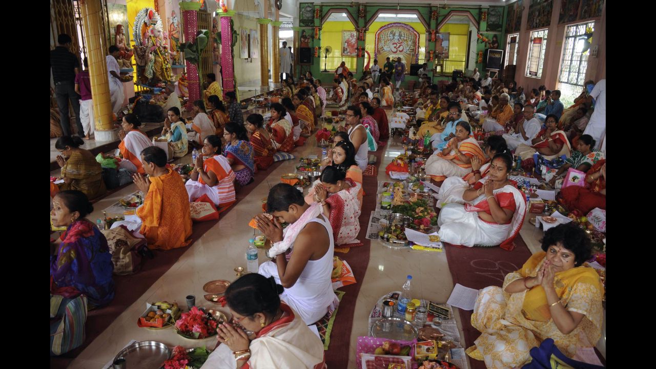 Devotees perform rituals in front of an idol of Lord Ganesh at a temple in Agartala, India, on September 5.