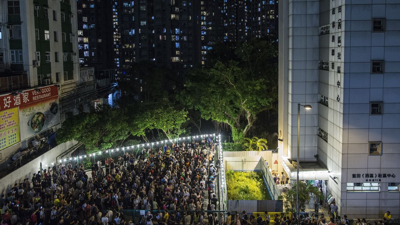 People line up to vote in Hong Kong. Sunday's election saw record turnout levels.