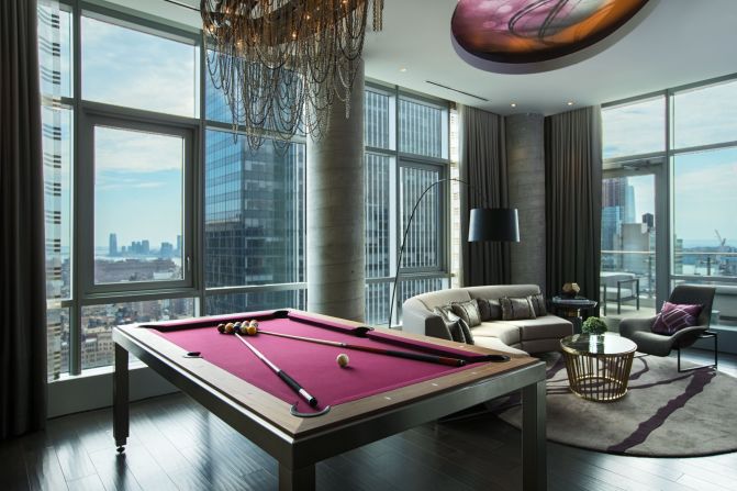 Perched on the 37th floor, the Renaissance New York Midtown's new Empire Suite features a living space complete with a pool table that can be transformed for dining.