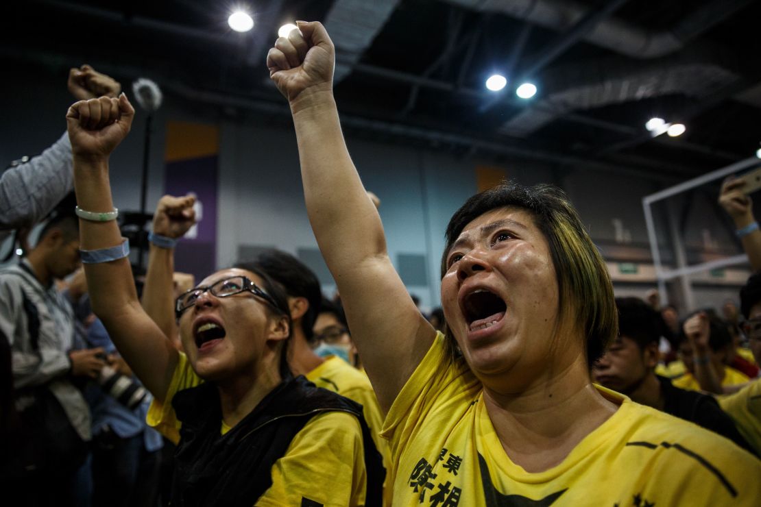Supporters cheer as the results of Hong Kong's Legislative Council election are announced. 