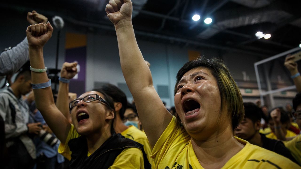 Supporters cheer as the results of Hong Kong's Legislative Council election are announced. 