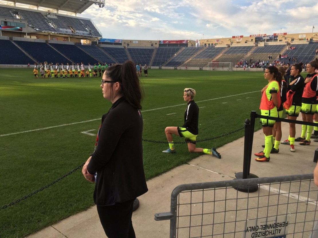 Seattle Reign midfielder Megan Rapinoe takes a knee as the National Anthem is sung ahead of the Reign's match with the Chicago Red Stars. 