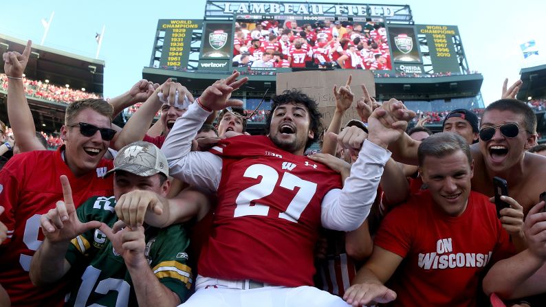 Wisconsin's Rafael Gaglianone, center, celebrates after his team beat Louisiana State University in Green Bay, Wisconsin, on Saturday, September 3. Wisconsin defeated LSU 16-14.