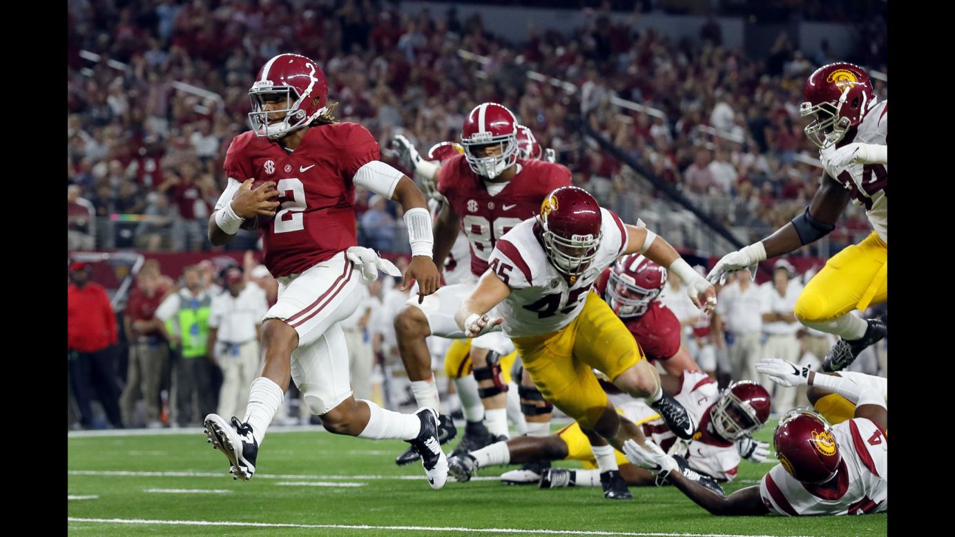 Alabama's Jalen Hurts runs for a seven-yard touchdown during a game against University of Southern California in Arlington, Texas, on Saturday, September 3. Alabama won by a landslide, defeating USC 52-6.