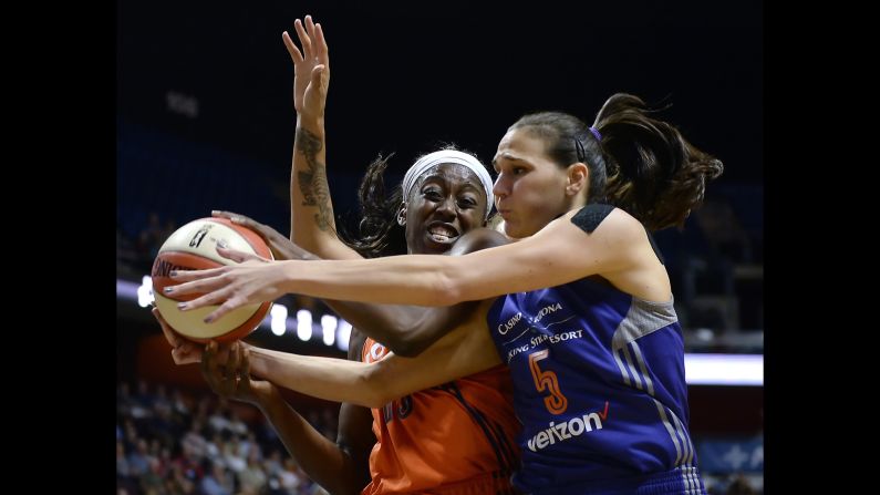 Connecticut's Chiney Ogwumike, left, and Sonja Petrovic of Phoenix battle for a rebound during a game in Uncasville, Connecticut, on Friday, September 2. Phoenix lost 74-87.