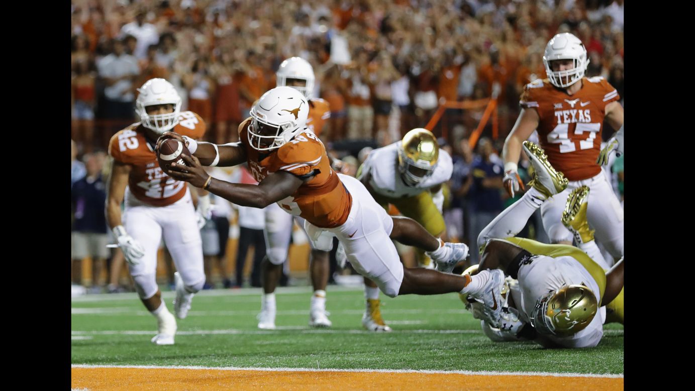 Tyrone Swoopes of the University of Texas goes for the game-winning touchdown against Notre Dame in Austin, Texas, on Sunday, September 4. Notre Dame lost 47-50.